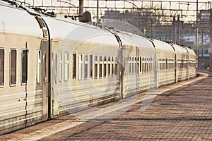 Passenger cars in the train at the platform at the station