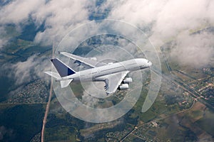 Passenger double decker plane fly high above the clouds