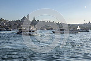 Passenger ferry boats cross Golden Horn at Karakoy in Istanbul in Turkey.