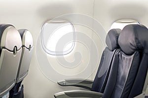 Passenger inside cabin flight gray interior half empty salon problem porthole window