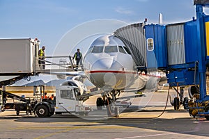 Passenger jet airplane docked at gate