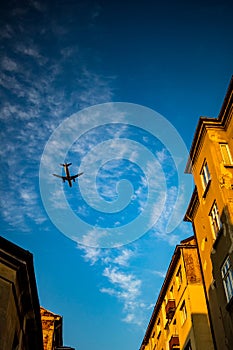 Passenger jet plane flies over street in Sofia