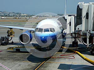 Passenger jet at terminal gate photo
