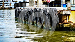 Passenger pier on the river with tires as bumpers and bumpers