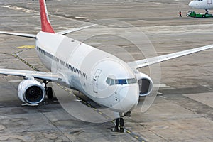 Passenger plane arrives after landing at the airport terminal