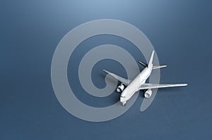 Passenger plane on a blue gray background. Passenger transportation. Business and tourism. Airline operators, air carriers. World