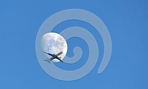 Passenger plane crossing the moon