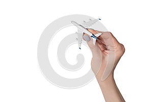 Passenger plane in female hand isolate on white background. Concept of safe flights