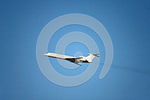 A passenger plane flying in the clear sky