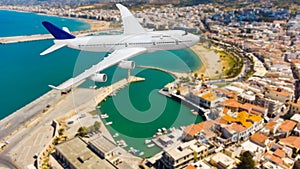 passenger plane flying over beautiful blue ocean and island in purity destination sea beach use for summer holiday