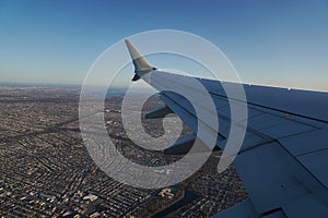 Passenger plane flying over Long Island, NY after take off from JFK International Airport