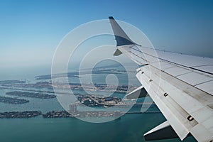 Passenger plane flying over Miami descends for landing at Miami International Airport