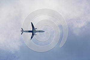 Passenger plane passing through the clouds