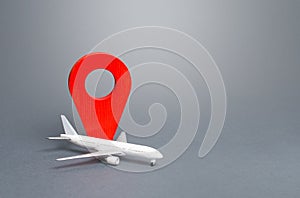 Passenger plane and red location indicator. Air travel. New rules for passengers transportation by air, quarantine measures.