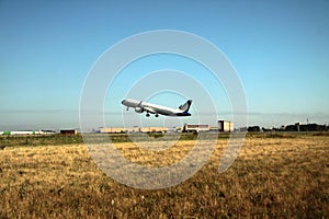 Passenger plane takes off from the airport runway