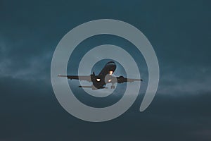 Passenger plane takes off at dusk, soon night
