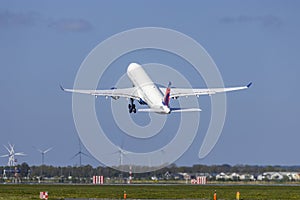 Passenger plane taking off from the runway, Schiphol, Amsterdam, The Netherlands