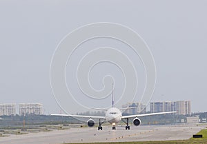 Passenger plane taxi on airport runway