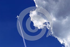 a passenger plane with vapour trails