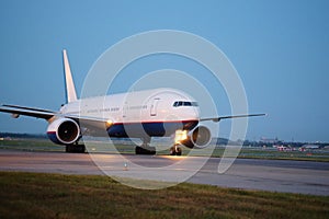 Passenger planes at the airport in the evening