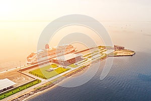 Passenger port with two cruise liners, preparing for departure on a trip