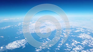 A passenger`s view looking out the window of an airplane flying though the clouds. Shot at 4k