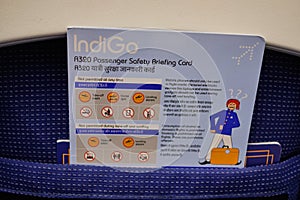 Passenger safety briefing card on an IndiGo Indian low-cost airline