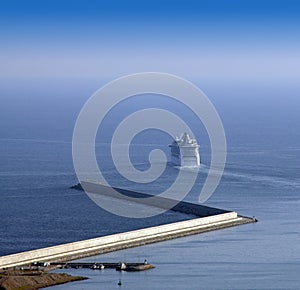 Passenger ship leaving port.