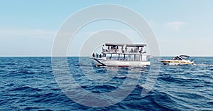 Passenger Ship And Mini Boat In Beautifull Blue Sea.