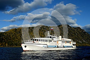 The passenger ship `Pioneer of Altai` is on the water area of Lake Teletskoye. Altai Republic