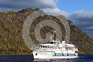 The passenger ship `Pioneer of Altai` is on the water area of Lake Teletskoye. Altai Republic