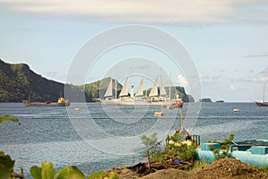 A passenger ship with sails unfurled at admiralty bay, bequia