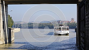 Passenger ship sails into water chamber Lock on River Danube in Melk, Austria