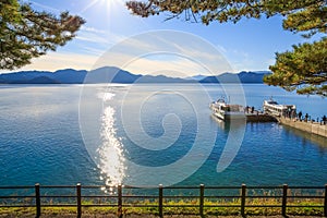 Passenger ships with sparkling sunshine in Lake Tazawa - Senboku, Akita, Japan