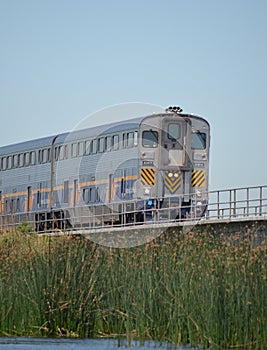 A Passenger Train Approaching Down The Tracks