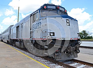 American passenger train diesel engine with coaches