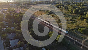 The passenger train leaves at sunset