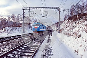 Passenger train moves along Baikal lake. Trans Siberian railway.