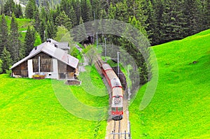 Passenger train moves from Chur to Arosa.