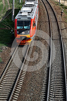 The passenger train moving along the coastlin