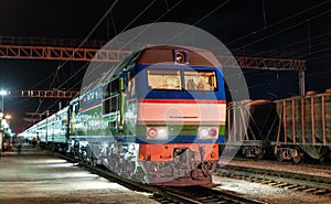 Passenger train at Navoi station in Uzbekistan photo