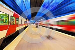 Passenger train passing railway station