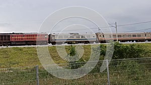 Passenger train passing by in rural area