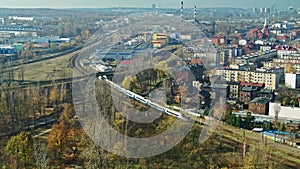 Passenger Train Ride On a City View - AERIAL