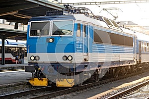 Passenger Train Waiting on the Platform of the Main Station, Electric Locomotive on an European Railway