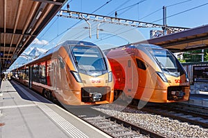 Passenger trains type Stadler Flirt of SÃÂ¼dostbahn at railway station in Arth-Goldau, Switzerland