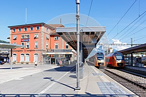 Passenger trains type Stadler Flirt of SÃÂ¼dostbahn at railway station in Arth-Goldau, Switzerland