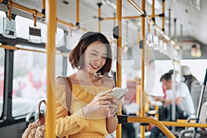 The passenger use smartphone in the bus or train, technology lifestyle, transportation and traveling concept