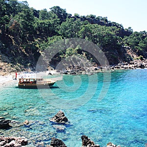 Passenger vessel waiting for tourists. Blue sea.