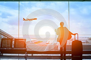 Passenger waiting for flight in airport, departure terminal